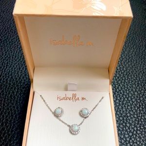 Silver necklace with silver earrings.